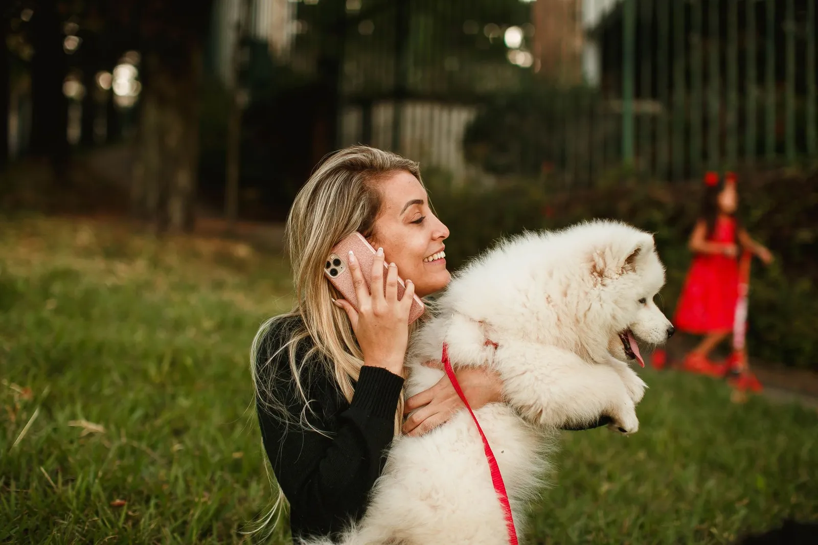 Dog looking up at a person calling their name outdoors