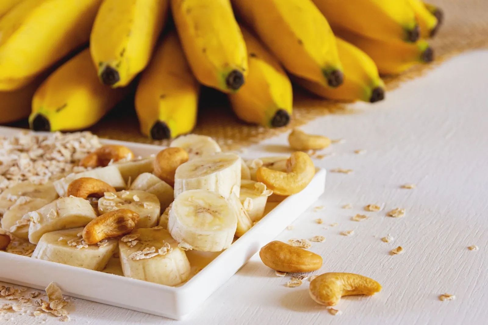 Fresh banana slices on a white plate