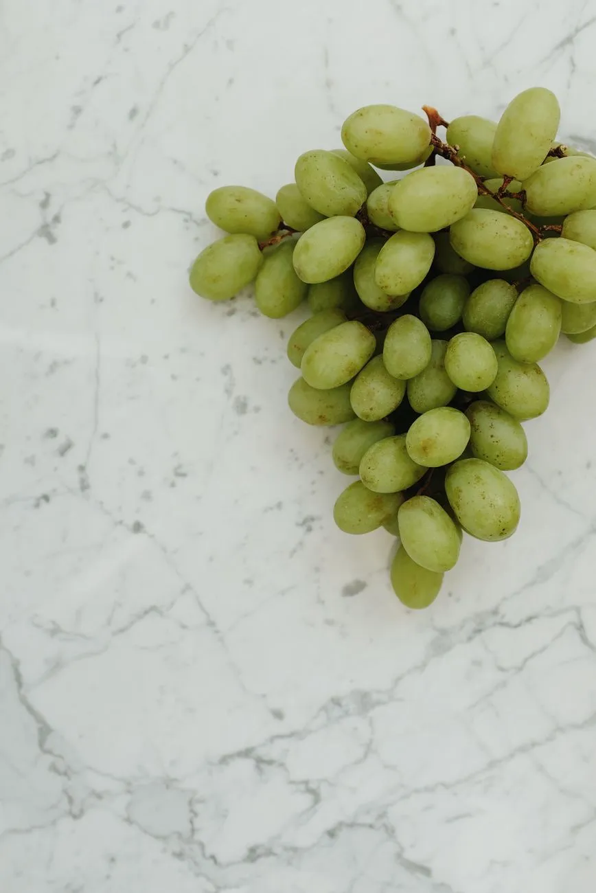 Bunch of fresh grapes on a kitchen table