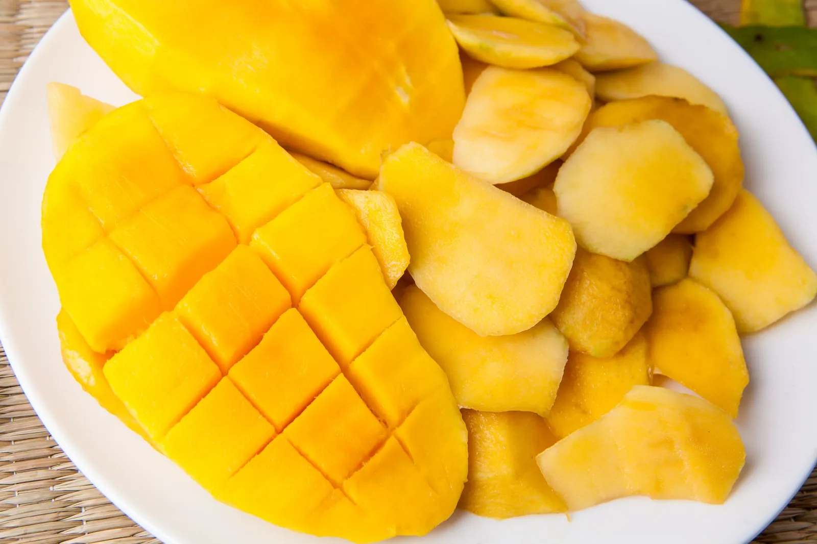 Fresh ripe mango cubes on a plate