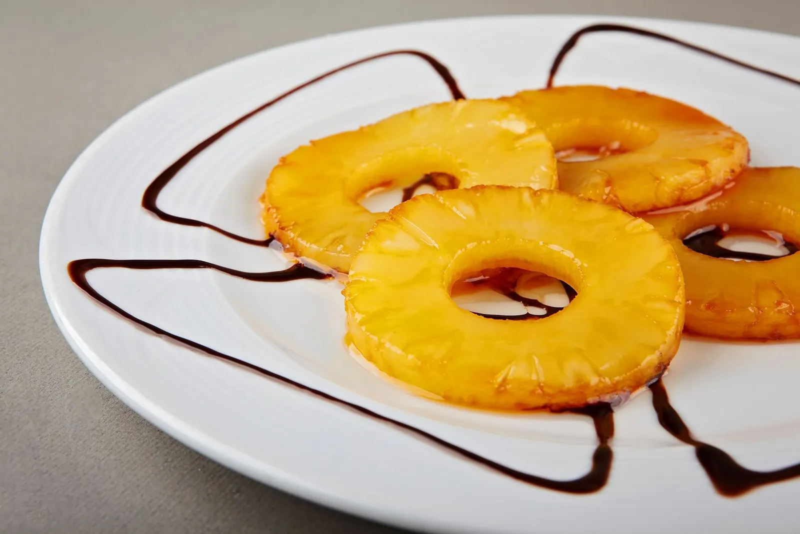 Caramelised pineapple rings on a plate