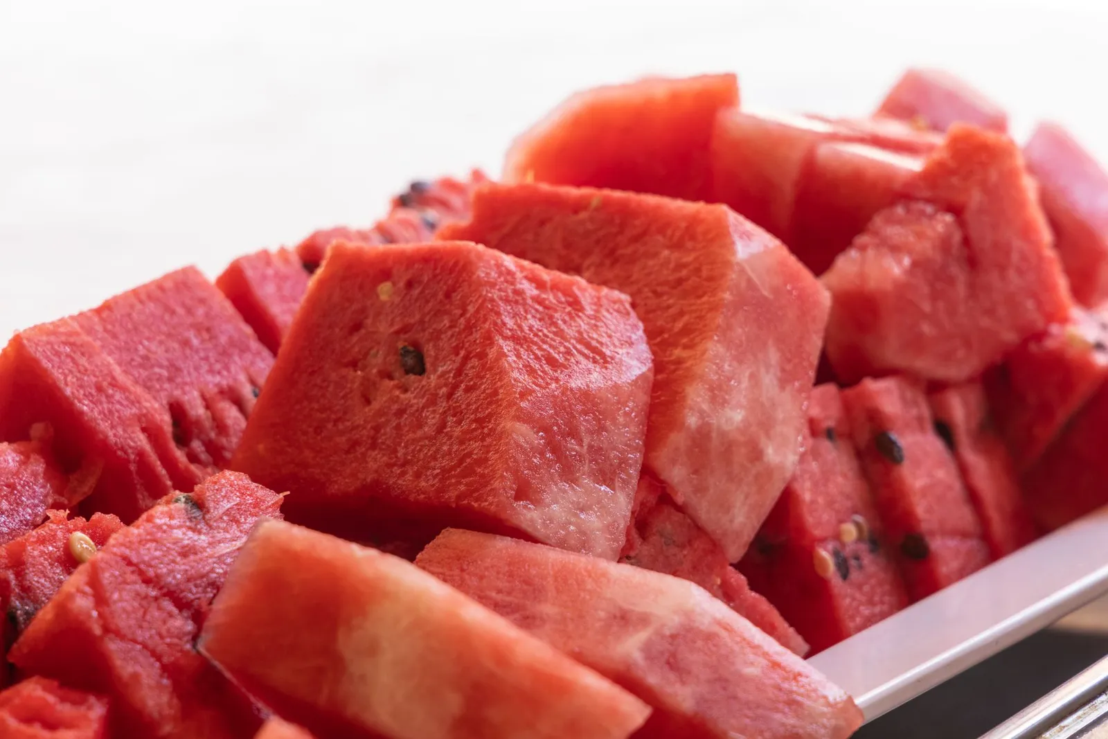 Sliced watermelon flesh cut into serveable pieces