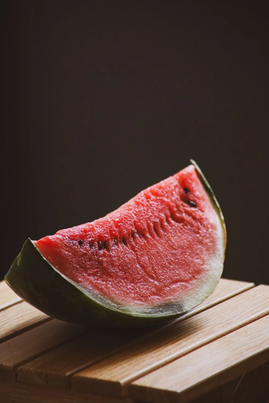 Watermelon quarter showing rind and seeds
