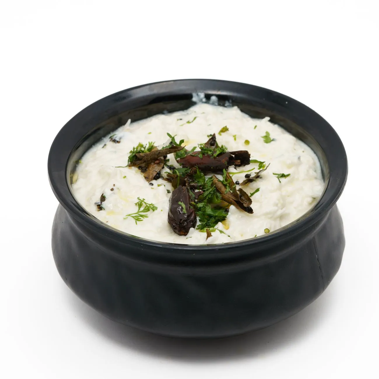 Bowl of plain unsweetened curd on a kitchen counter