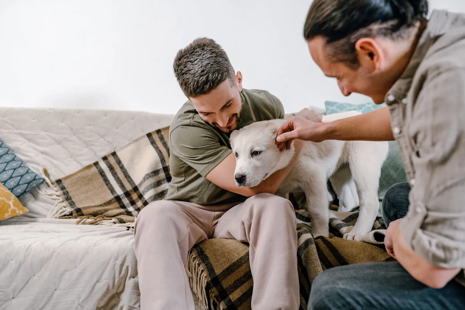 Family sitting with a newly adopted dog at home