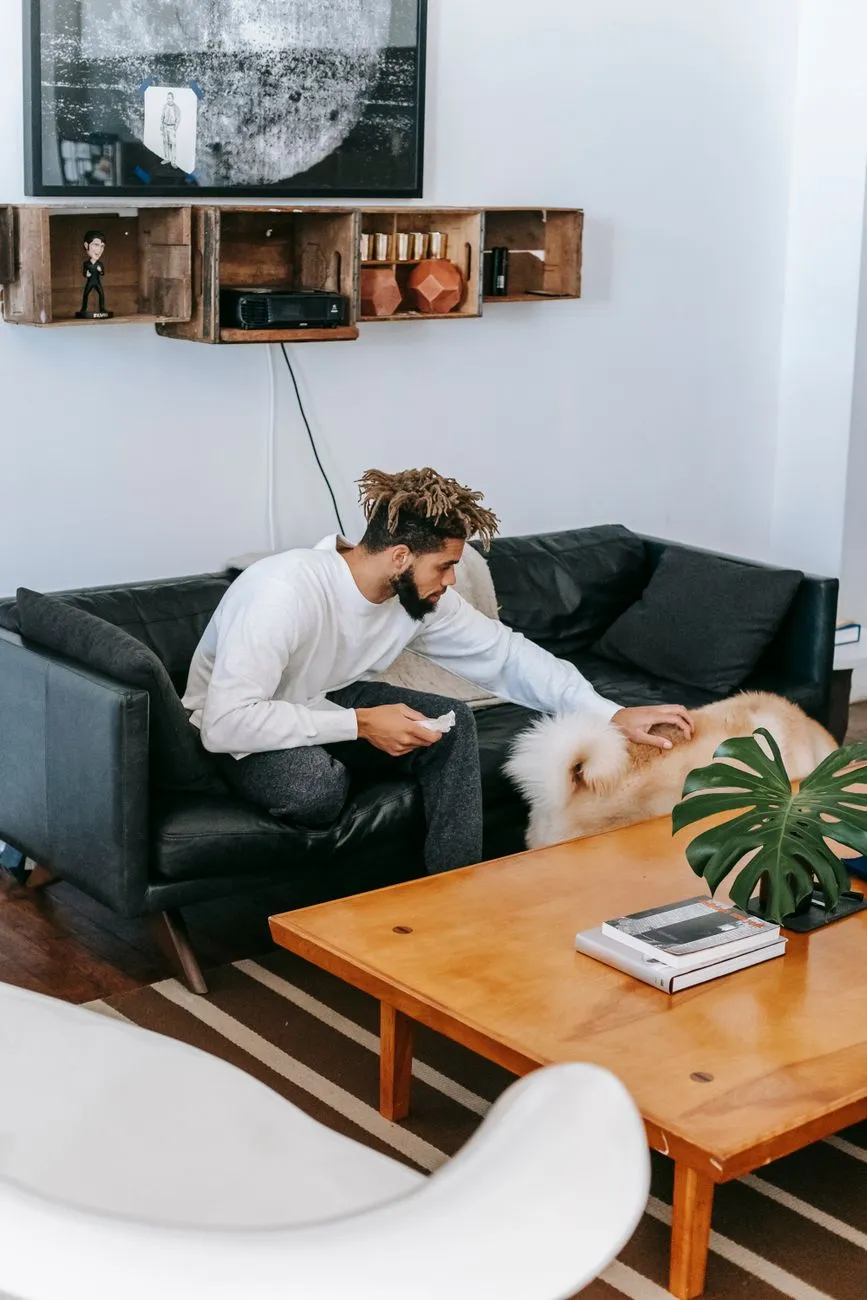 Dog relaxing with owner in an Indian apartment living room