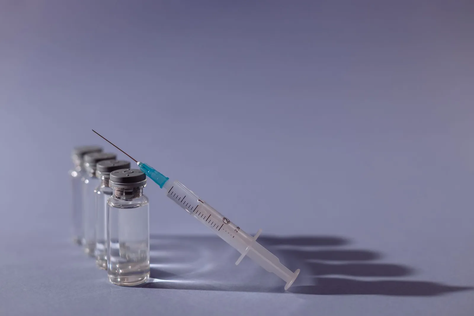 Vaccine vial and syringe that belong with a veterinary cold chain