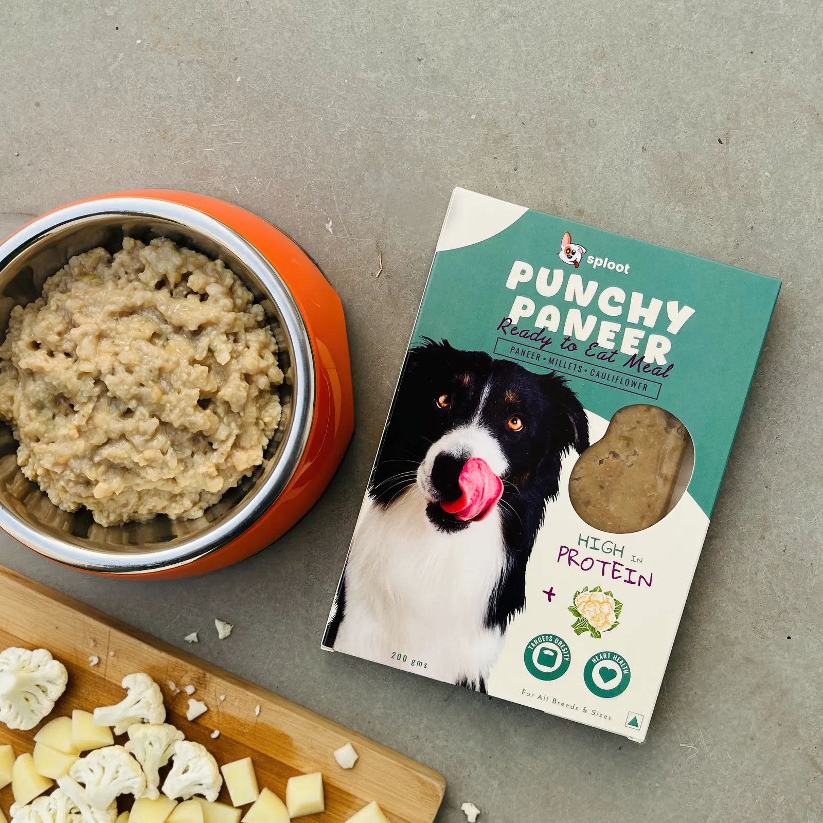 Sploot Punchy Paneer vegetarian dog food pack beside a bowl of the cooked meal, paneer and cauliflower