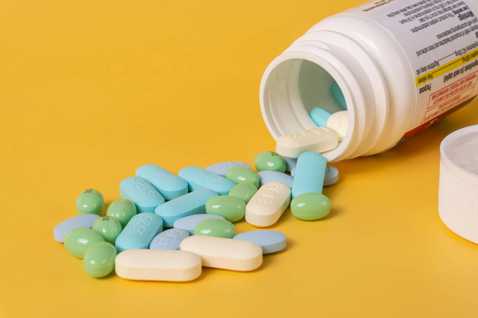 Medicine bottles and pills — never guess human fever drugs for dogs